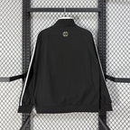 Cortavientos amarillo y negro del Real Madrid 2026
