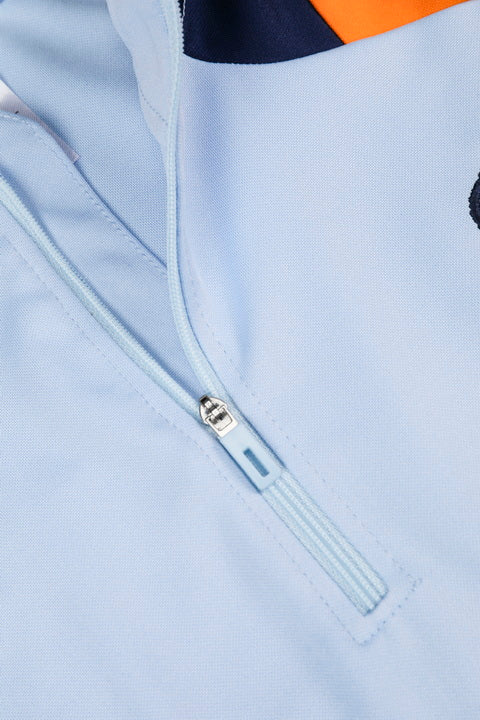 Traje de entrenamiento naranja y azul del Real Madrid 2025-26