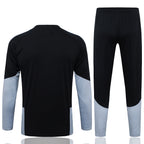 Traje de entrenamiento negro y gris del Real Madrid 2026-27