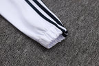 Chándal de entrenamiento blanco y verde con cremallera larga del Real Madrid 2025-26
