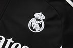 Chándal de entrenamiento negro del Real Madrid 2025-26 (texto blanco)