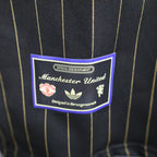 Versión de jugador negra de estilo informal del Manchester United 2025-26